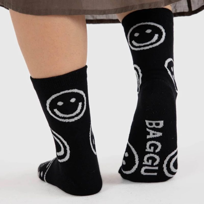 baggu black happy bamboo rayon unisex crew socks on model back view