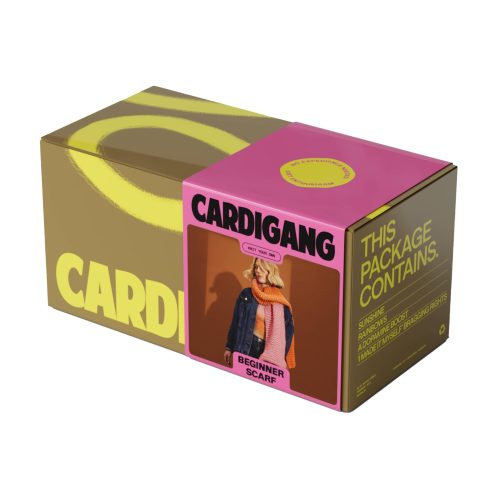 Cardigang two-tone Orange and Pink Harper Beginner Acrylic Scarf Knit Kit in box packaging, front angle view.