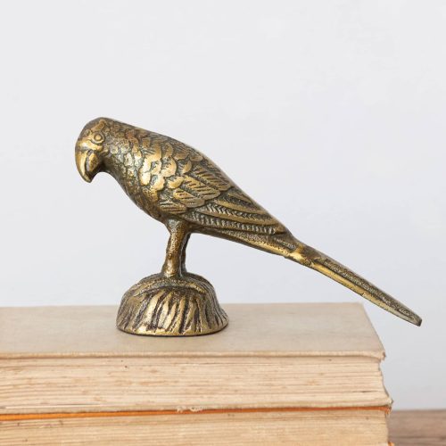 creative coop df7070 cast aluminum bird in antique gold finish side view on book