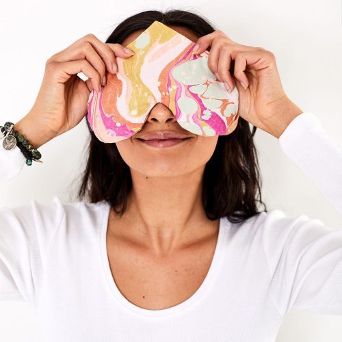 love mert heart eye pillow in paradiso pattern on model