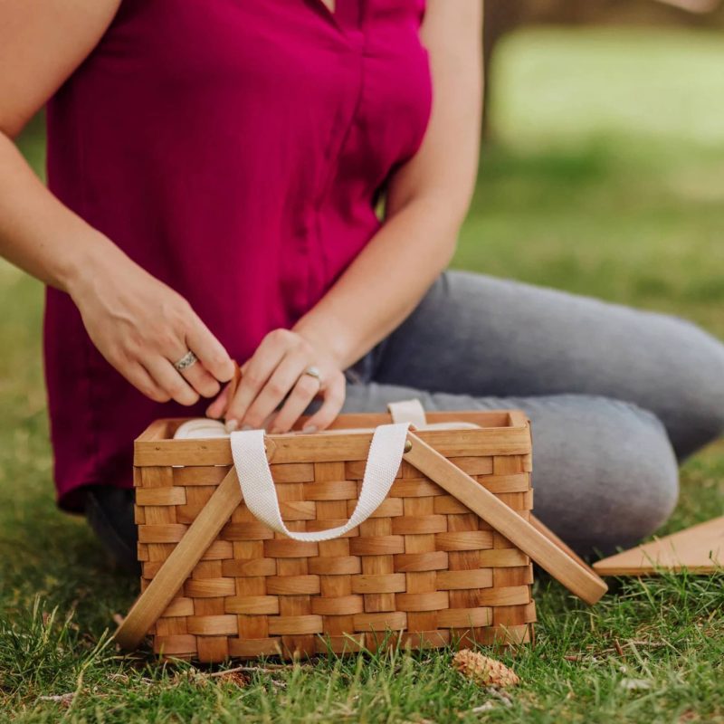 picnic time poppy personal handwoven wicker picnic basket in grass with person