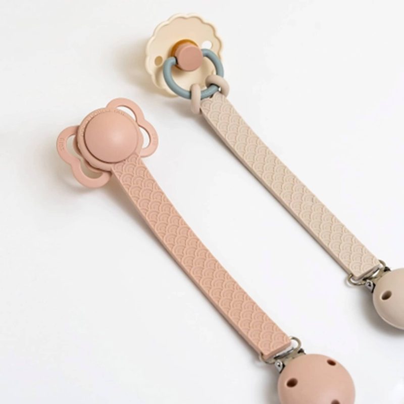 the cotton cloud scallop pacifier holder in use